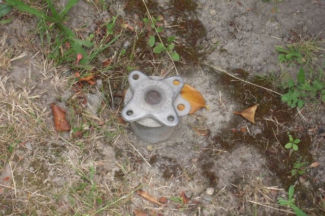 underground oil tank fill valve coming out of the ground