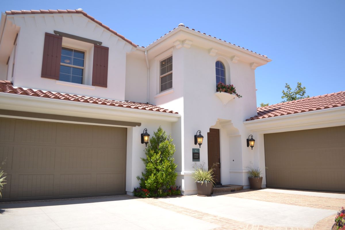 white house with two garage doors