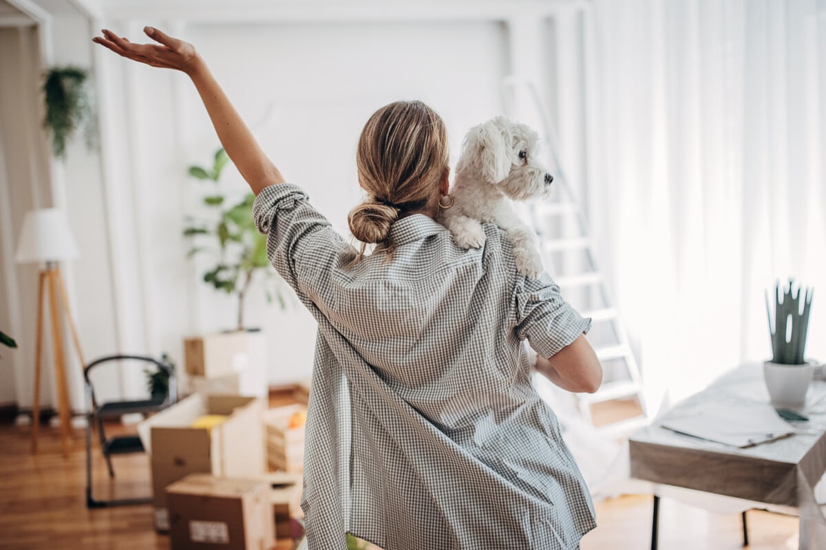 Woman with her dog in new home