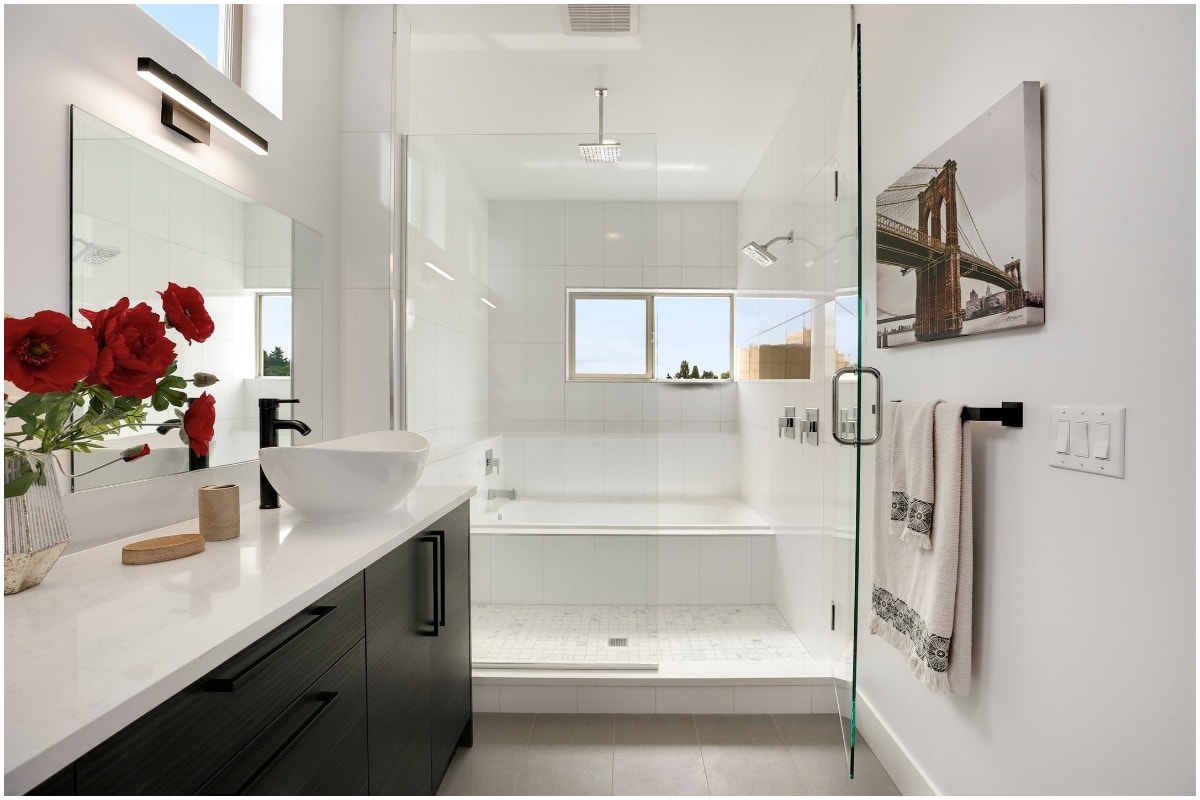 Clean white bathroom dark cabinets