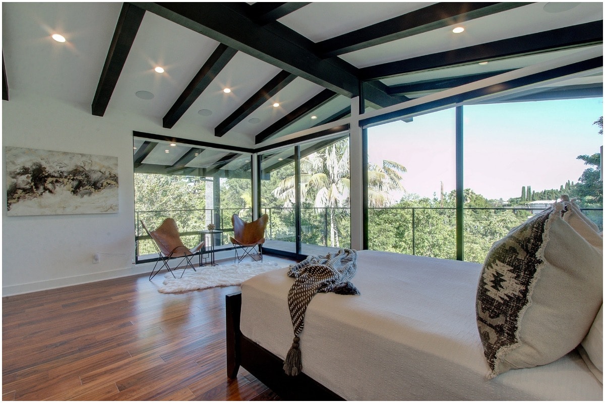 black exposed beams in primary suite views