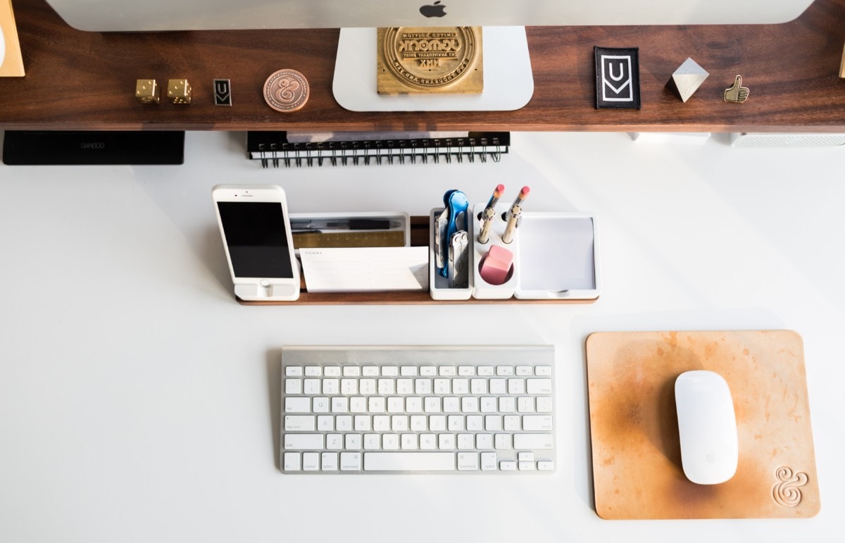 Organized desk with mouse, keyboard, and screen