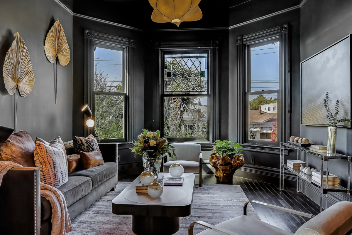 interior of a victorian house with black walls and bay windows