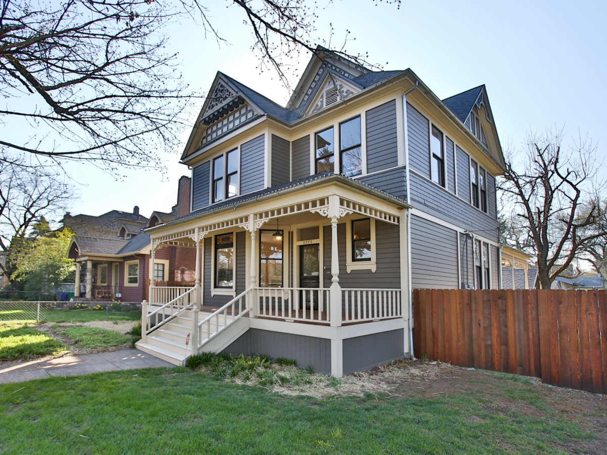 folk victorian home with a porch and minimal detailing