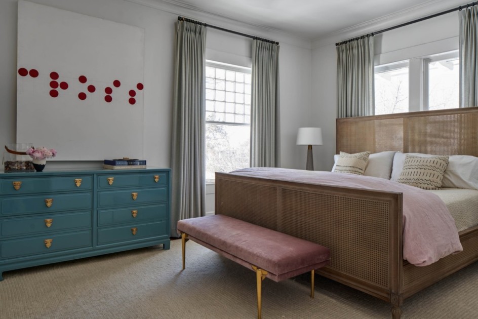 Neutral colored bedroom with blue dresser
