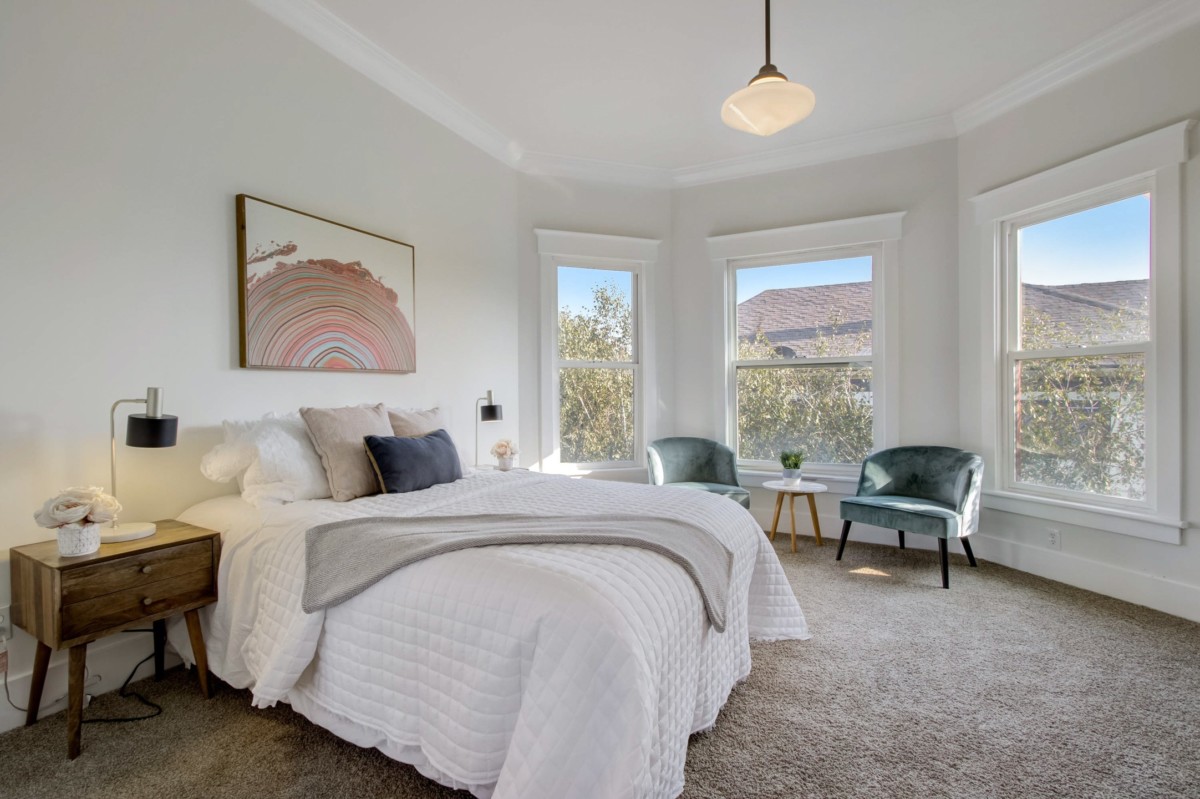 simple room with nice painting, minimalist tips for decluttering your home