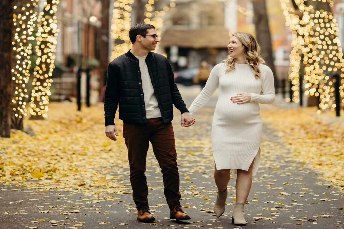 couple walking down addison street