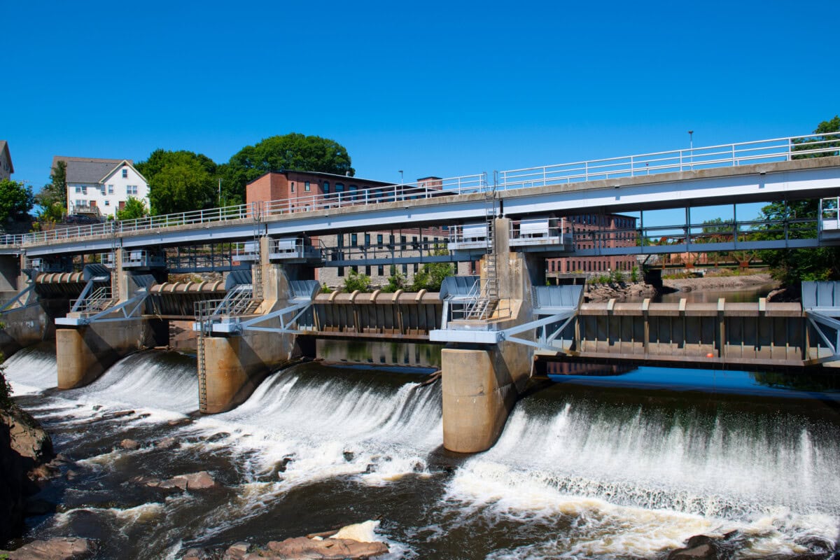 woonsocket falls and downtown view - shutterstock
