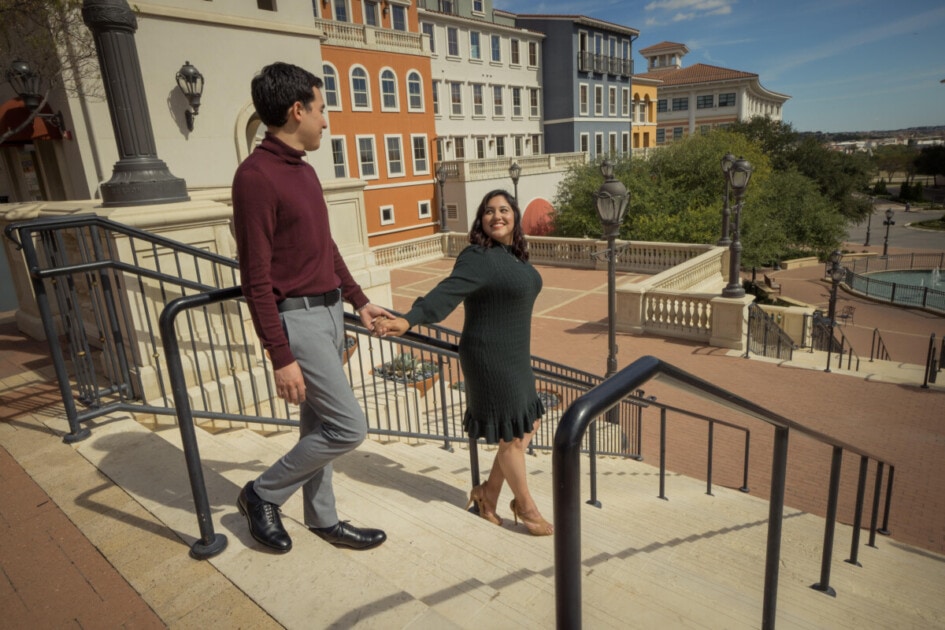 A couple stands on the steps of Eilan Hotel and Spa, captured by David Pezzat.