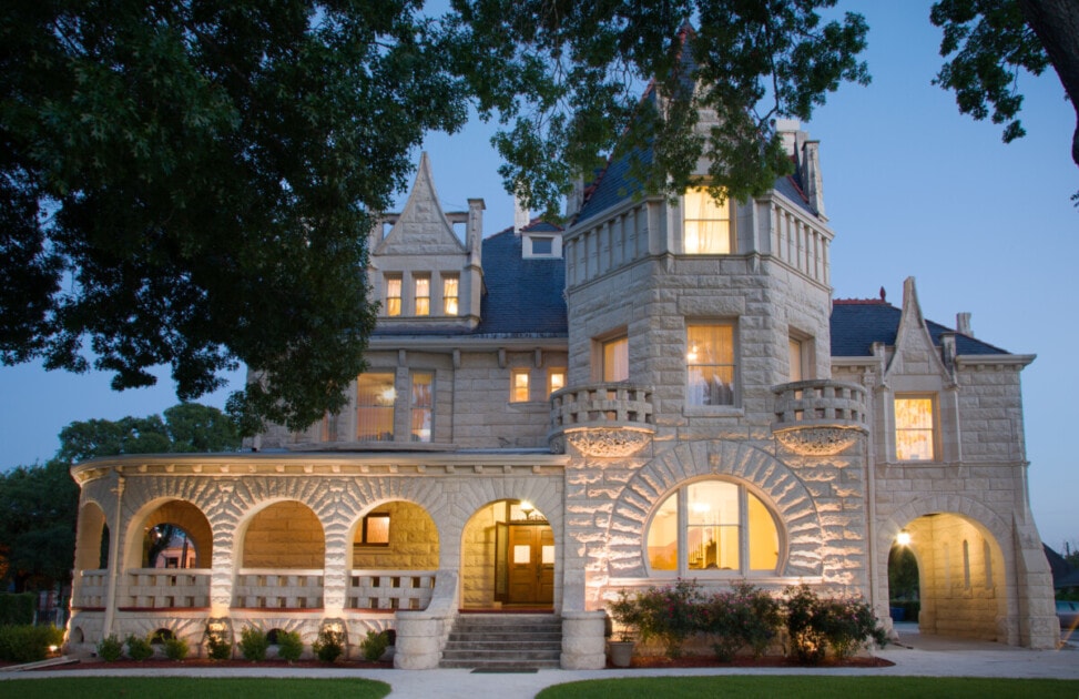 A photo of the Lambermont Estate at night, one of the beautiful places in San Antonio. 