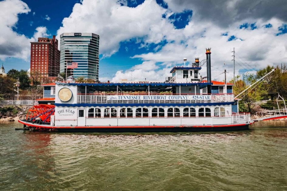 Large tour boat sitting on river