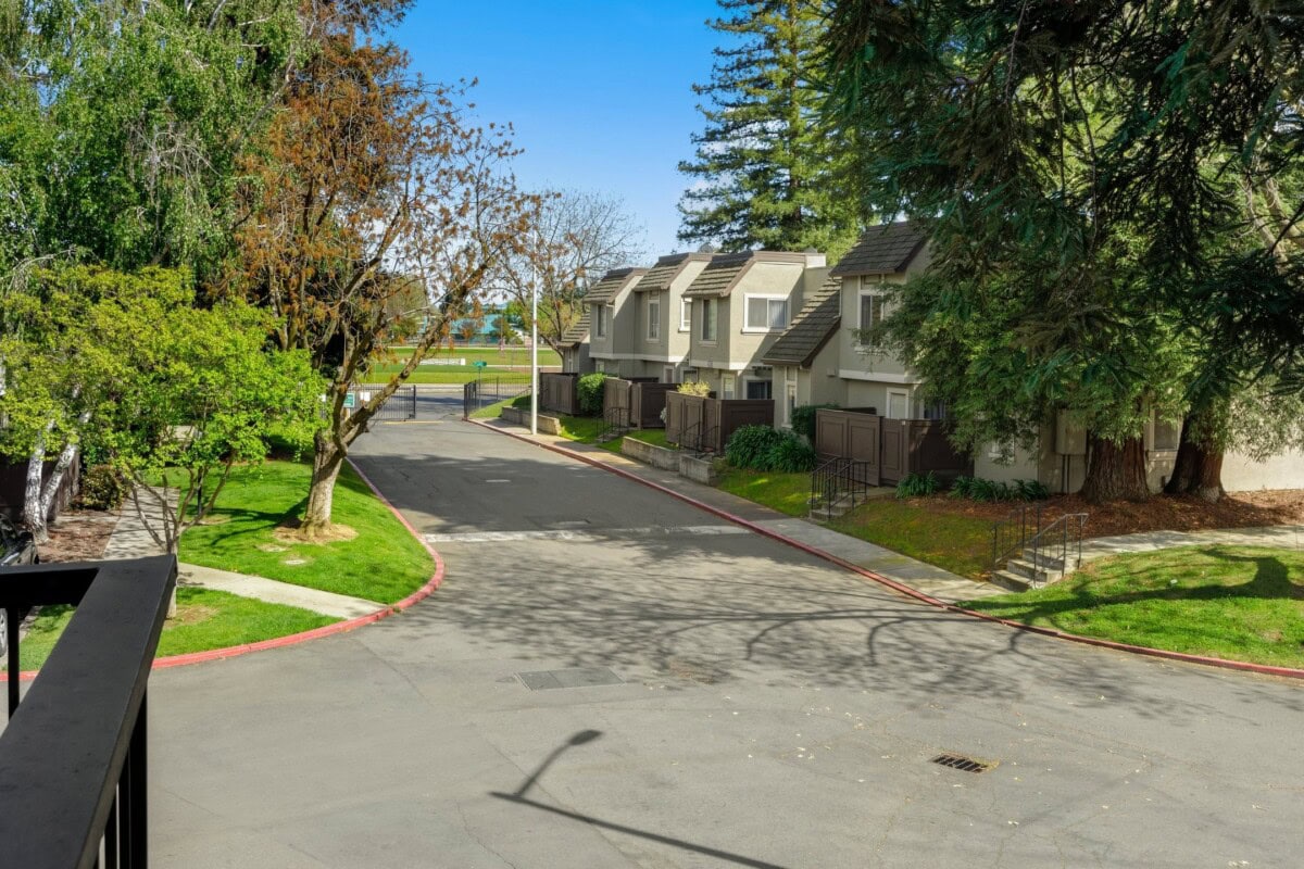 condominium complex in south natomas neighborhood of sacramento with large lush trees